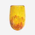 The Amokura Tumbler Glass in Golden on a blank background