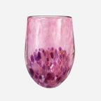 The Amokura Tumbler Glass in Pink on a blank background