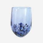 The Amokura Tumbler Glass in Sky Blue on a blank background