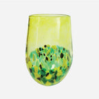 The Amokura Tumbler Glass in Green on a blank background