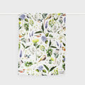 The Father Rabbit Botanica Cream Tea Towel hanging on a rod on a blank background