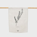 The Father Rabbit Rosemary Tea Towel hanging on a rod