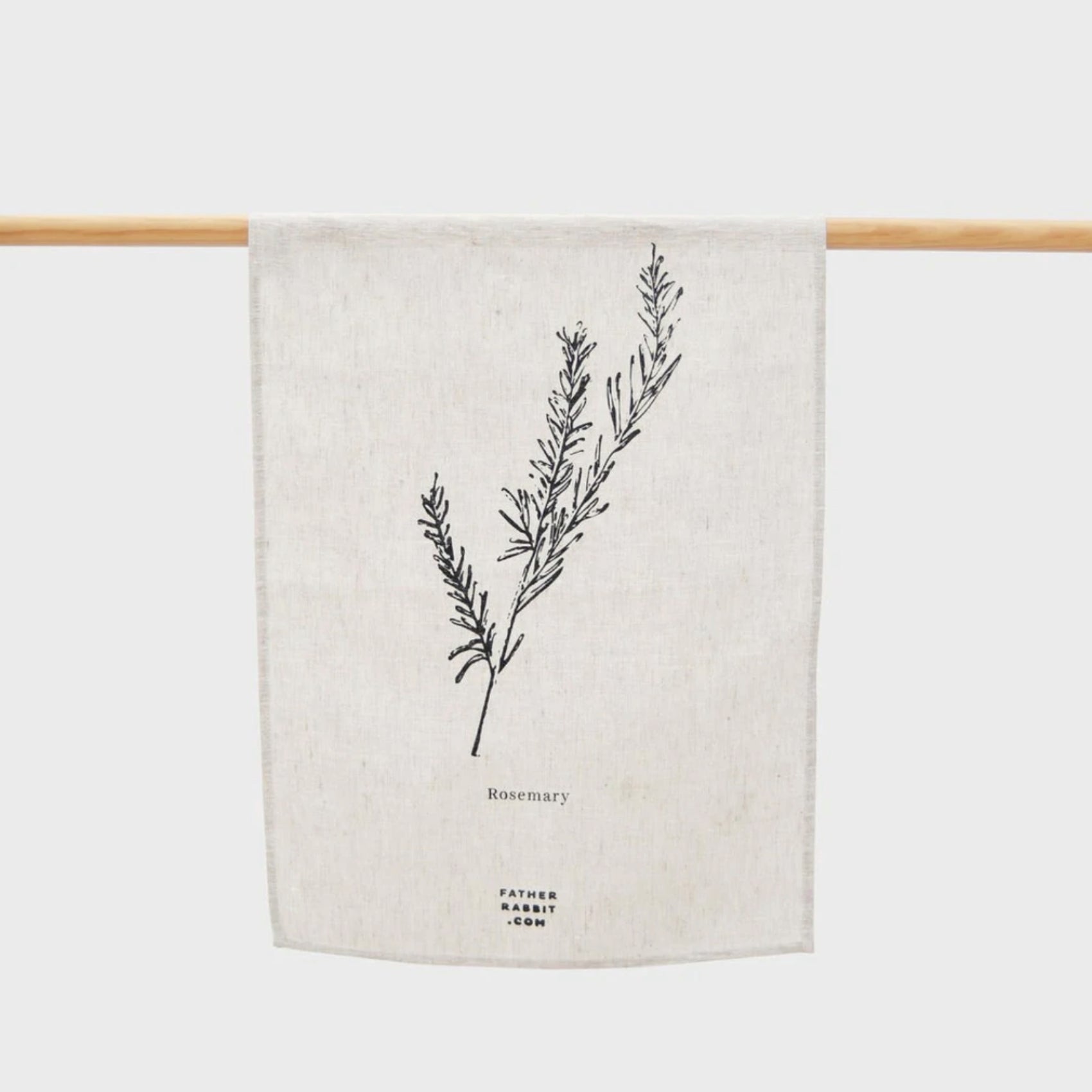 The Father Rabbit Rosemary Tea Towel hanging on a rod