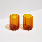 The Fazeek Wave Glasses in Amber on a blank background