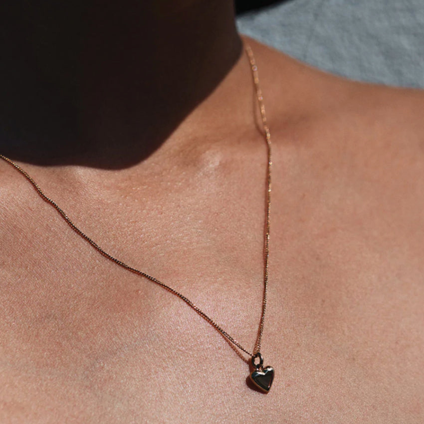 The Meadowlark Mini Camille Necklace in Gold on a model