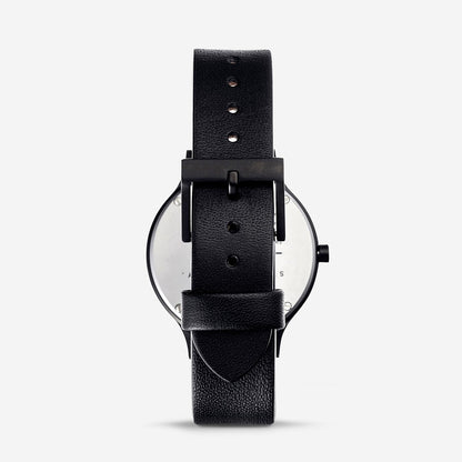 Status Anxiety Inertia Watch in Matte Black with White Face and Black Strap Back View