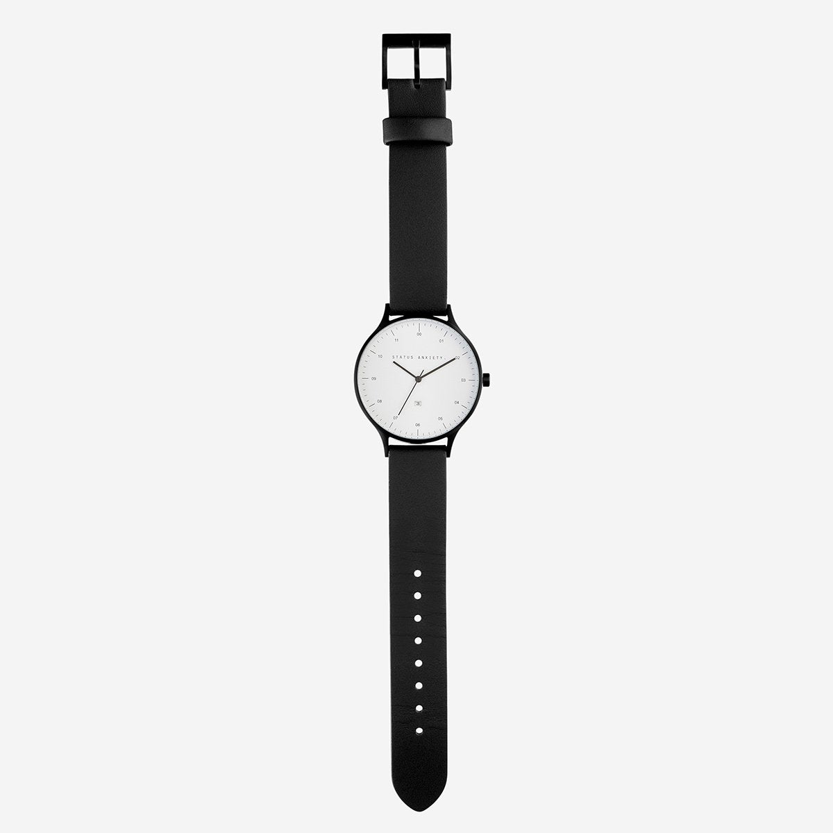 Status Anxiety Inertia Watch in Matte Black with White Face and Black Strap Fully Layed Out