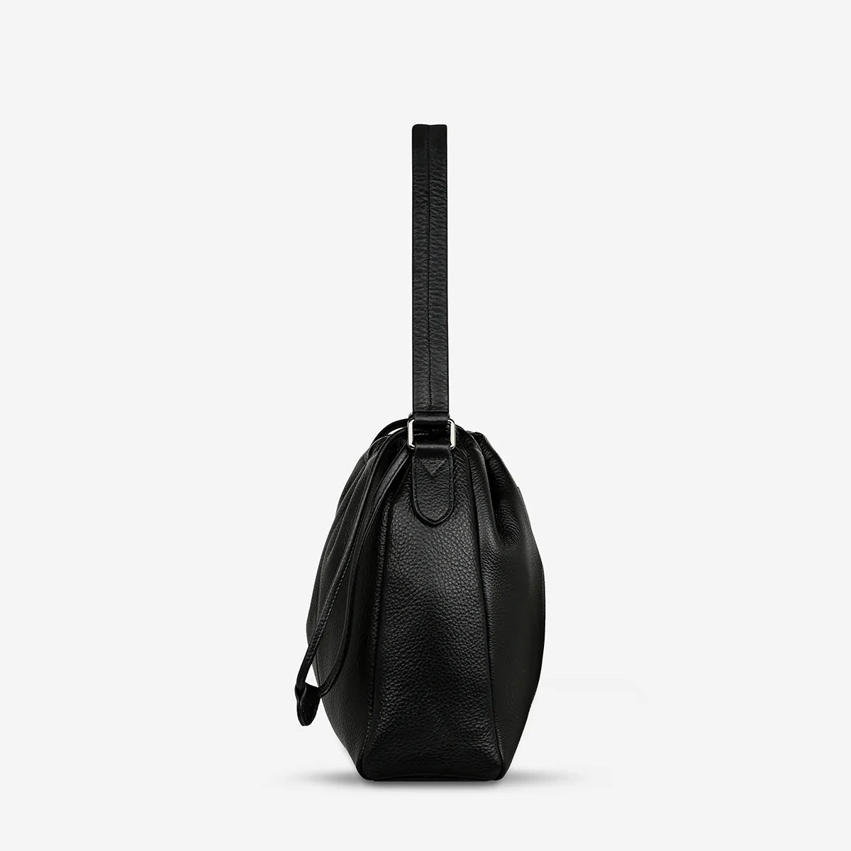 A side view of the Status Anxiety Point Of No Return Bag in Black on a blank background