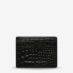 The Status Anxiety Together For Now Wallet in Black Pebble on a blank background