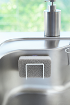 Yamazaki Tower Sponge Holder with Suction in White in sink